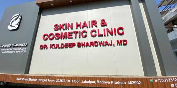 Clinic façade with bold red signage for skin, hair, and cosmetic treatments.