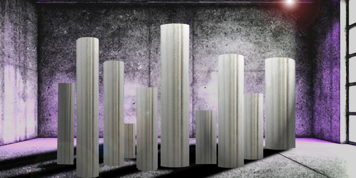 Tall silver cylinders in a dimly lit, purple-hued room.