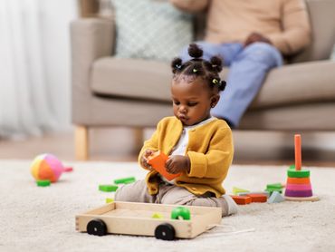 Toddler playing with toys