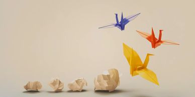 Paper turning into birds in an origami style illustrating digital transformation
