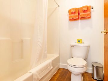 White bathroom with pink towels