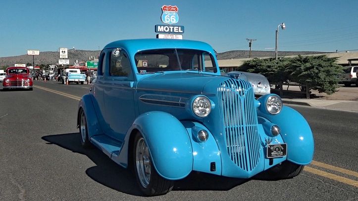 Restored classic custom car traveling Route 66 in Seligman, Arizona.