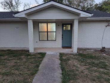 Enhancing a home with accent colors on the front door.