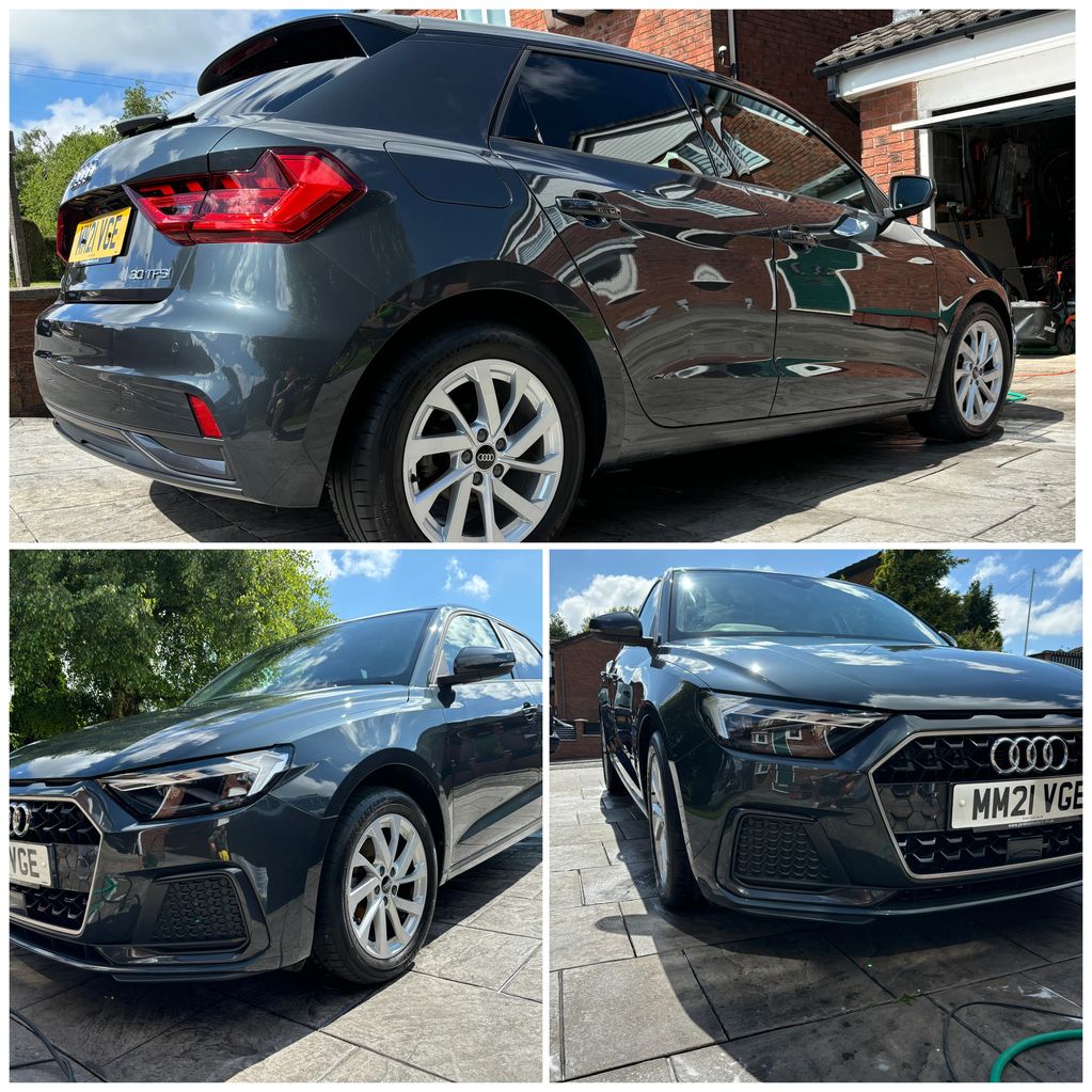 Sleek dark gray Audi A1 parked on a sunny driveway with clean detailing.
