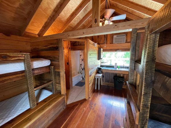 Interior of Boxcar Bunk Cabin at Trestle Park's Elk River Cabins in Ginger Blue - Noel, Missouri