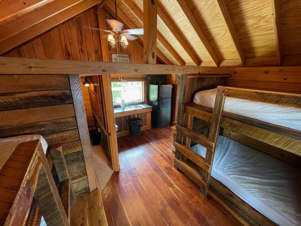 Interior of Boxcar Bunk Cabin at Trestle Park's Elk River Cabins in Ginger Blue - Noel, Missouri
