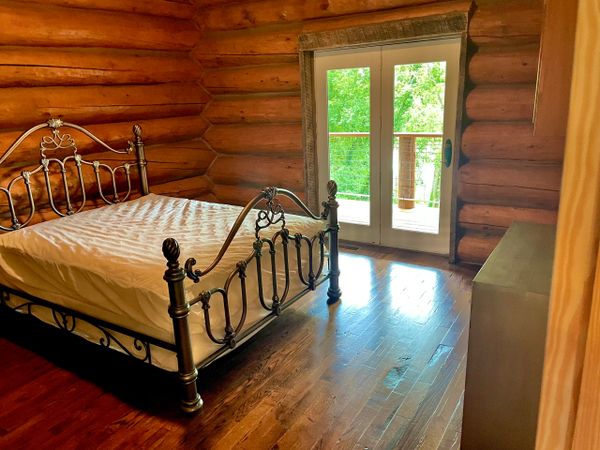 Master Bedroom of Engelmann Spruce Lodge at Trestle Park in Ginger Blue - Noel, Missouri