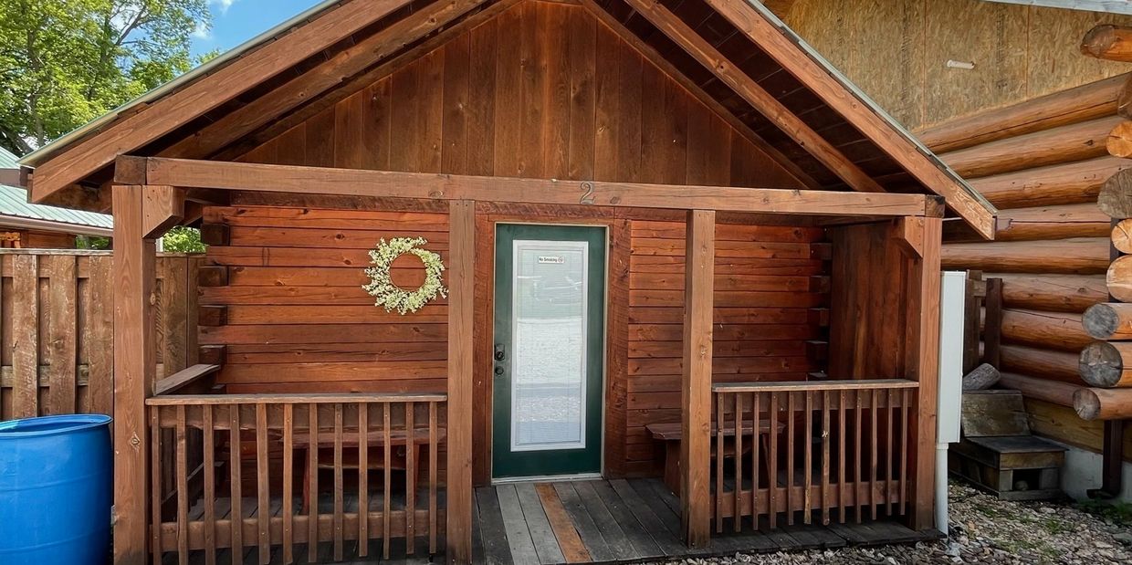 Front of Boxcar Bunk Cabin at Trestle Park's Elk River Cabins in Ginger Blue - Noel, Missouri