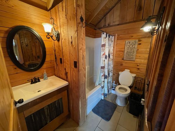 Bathroom in Boxcar Bunk Cabin at Trestle Park's Elk River Cabins in Ginger Blue - Noel, Missouri