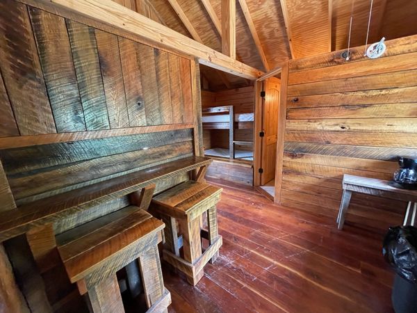 Interior of Boxcar Bunk Cabin at Trestle Park's Elk River Cabins in Ginger Blue - Noel, Missouri