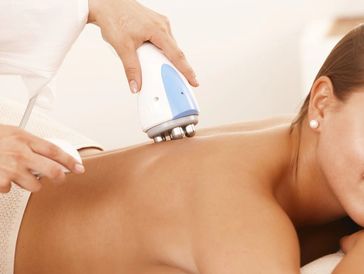 a woman receving Fat Reduction with Radio frequency