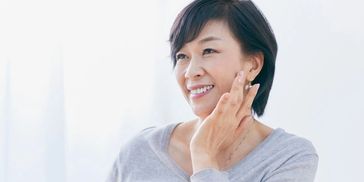 Older Asian woman with beautiful skin
