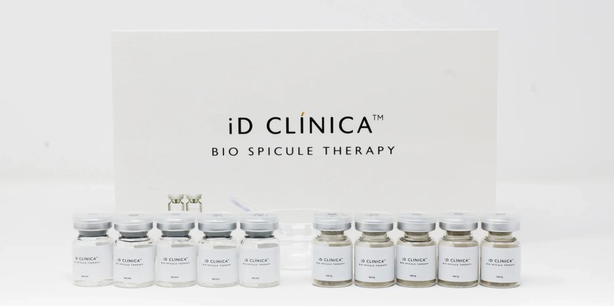 iD CLÍNICA Bio Spicule Therapy bottles arranged in front of a branded box.