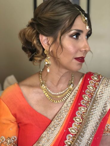 Myriam in ceremonial dress reflecting global spiritual and healing influences.