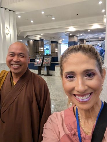 Myriam with a Buddhist monk during her holistic healing and spiritual education.