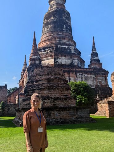 Myriam exploring ancient temple ruins as part of her spiritual journey.