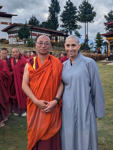 Myriam with Buddhist monks during a spiritual retreat.