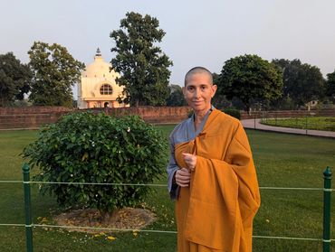 Myriam standing in a temple garden.