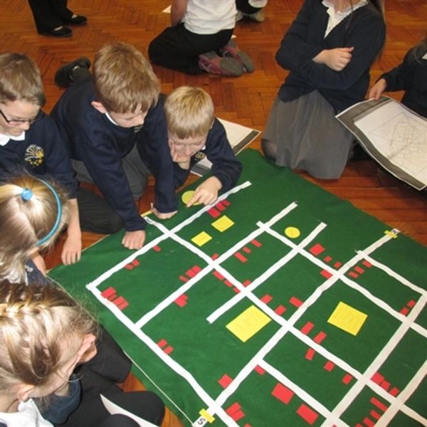 Children making a Roman town plan.
