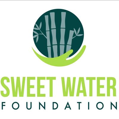 Logo of Sweet Water Foundation with bamboo and hand.