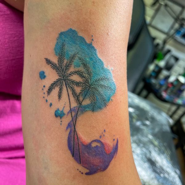 Watercolor tattoo, with palm tree line work.