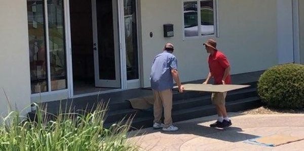 Teamwork - installing a ramp to begin loading the truck.