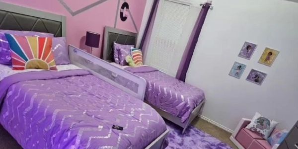 Kid's room Purple satin sheets, zigzag pattern, new bed, wall decor, purple rug, pink wall, curtains