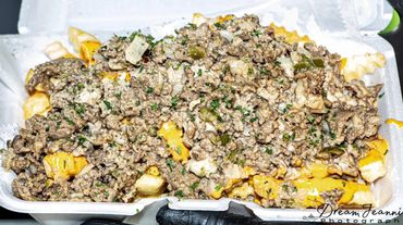 Shaved Beef and melty smoked provolone with peppers and onions for the ultimate loaded fries!