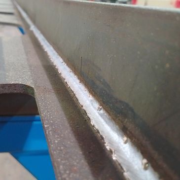 Close-up of a metal surface with welding seam.