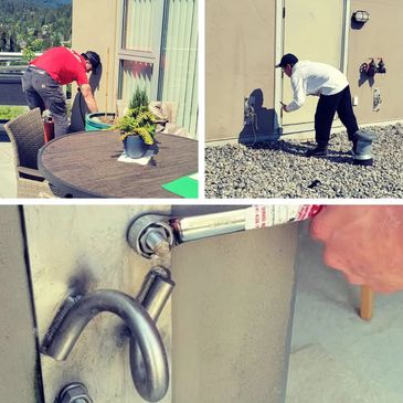 People inspecting and repairing outdoor door mechanisms.