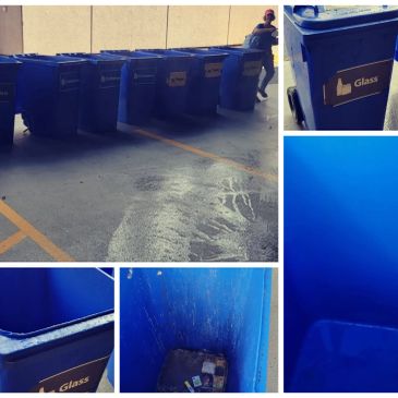 Empty blue recycling bins labeled for glass and paper.