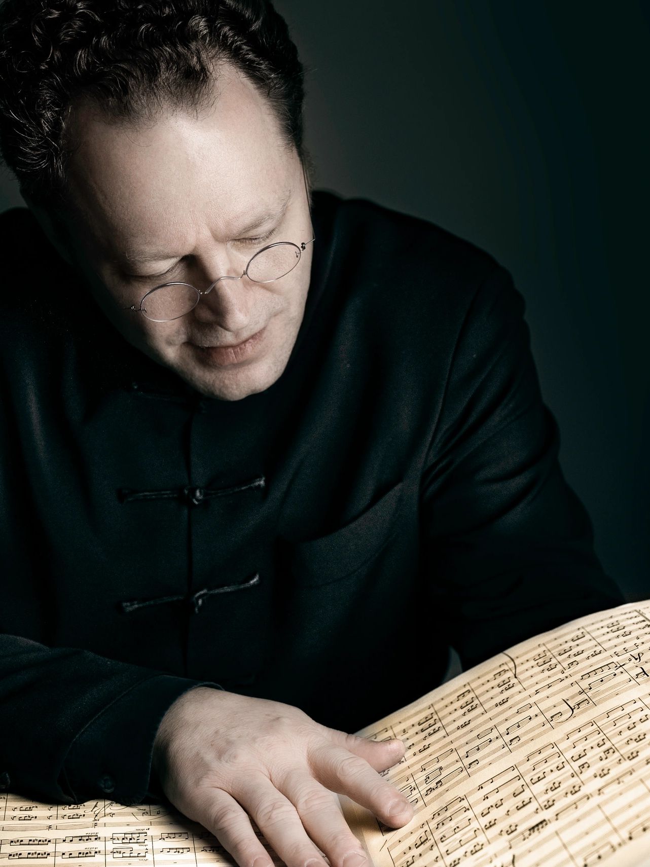 Photo of a man reading music symbols