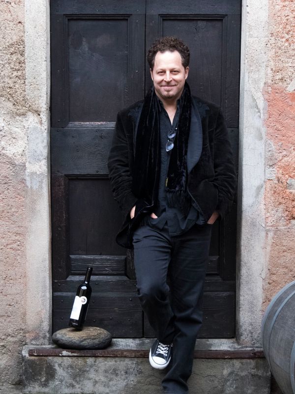 John Axelrod in Ticino with wine, photo by Daniel Vass