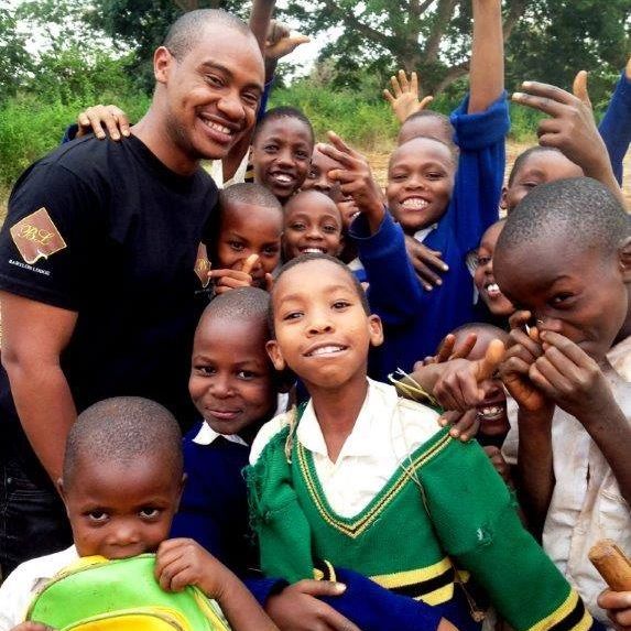 The director at Babylon Lodge Bobby Lyamuya with the children of Makuyuni Primary School.
