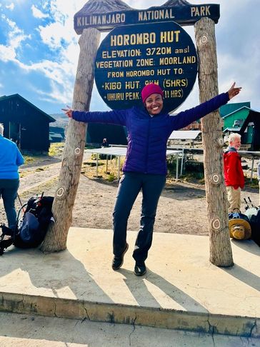 Sekunda Stephen Lyamuya a director at Babylon Lodge climbing Mt. Kilimanjaro.