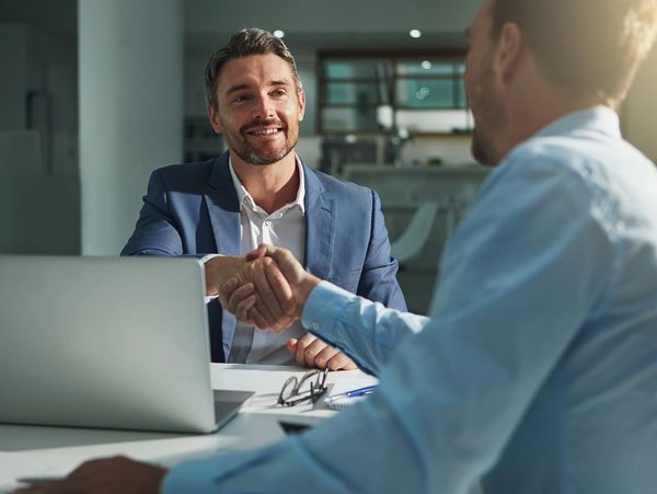 Two businessmen discussing a project.
