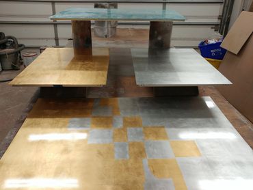 First layer of gold/metal leaf on gilded panels