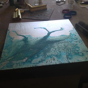 Gilded panel with blue/copper patina