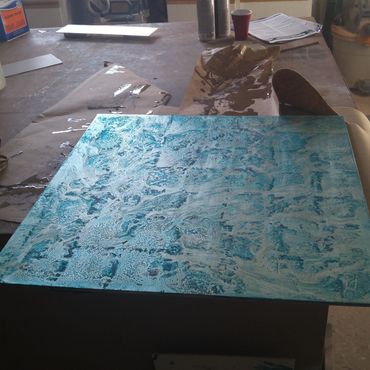 Gilded panel with blue/copper patina