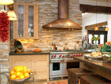 Rustic kitchen with stone walls and wooden accents.