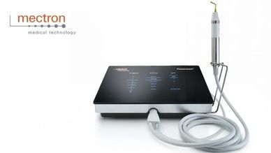 Mectron medical device with a sleek control unit and attached handheld instrument.