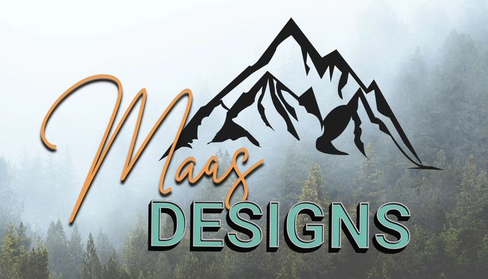 Logo of Maas Designs with mountain and forest background.