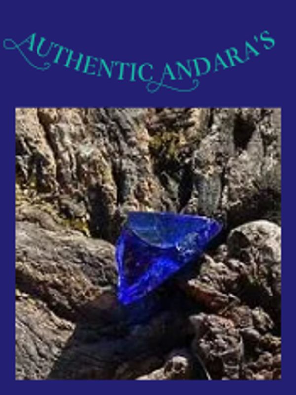 A vibrant blue gemstone resting on textured bark with 'Authentic Andara's' text above.