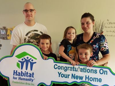 Habitat family in their new home