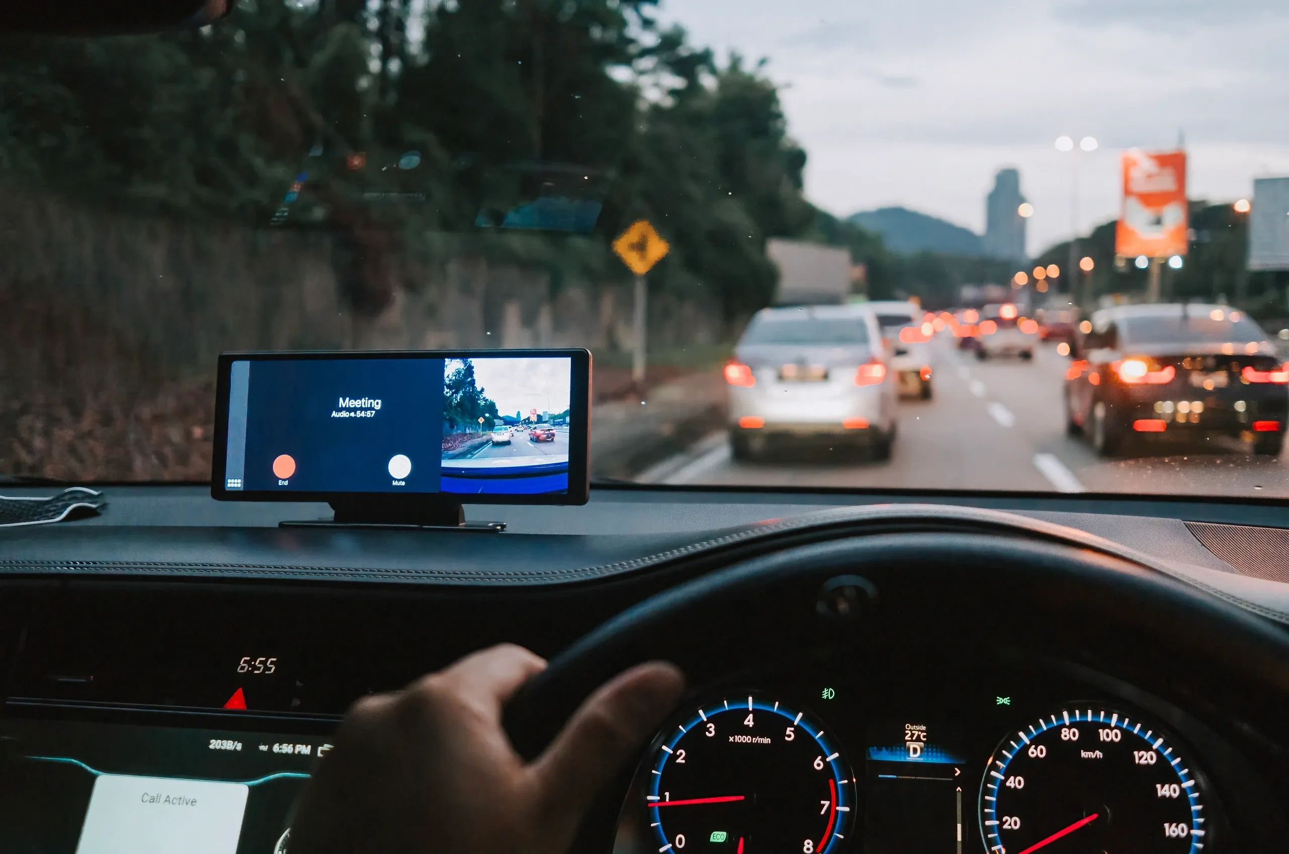 Driver's view of a dash camera display while driving in traffic