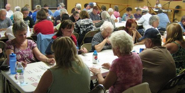 Park residents and guests playing card bingo in our rec hall.