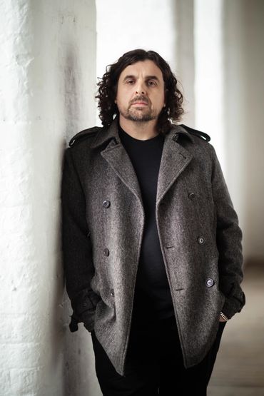 Male personal branding portrait photographed in a natural- light Manchester studio.