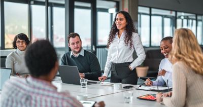 Group discussion in a modern office meeting room.