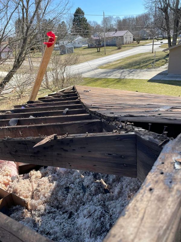 Boards getting old and crooked? We've got you covered. Before picture of a roof.