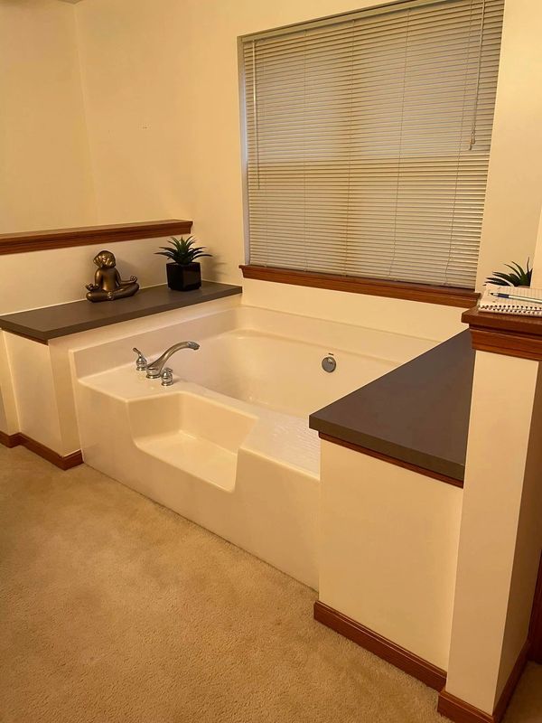 Homeowner wished for stand-up custom tile shower installation.
